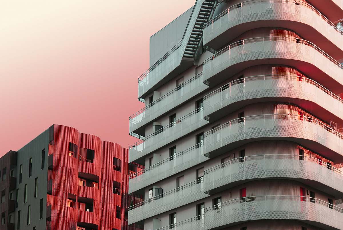 town architectural photography of beige and red city buildings high rise