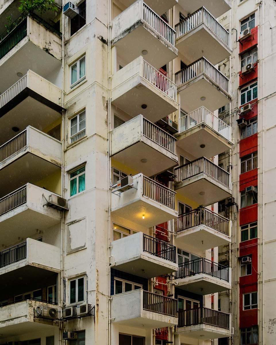 urban architectural photography of beige concrete house banister