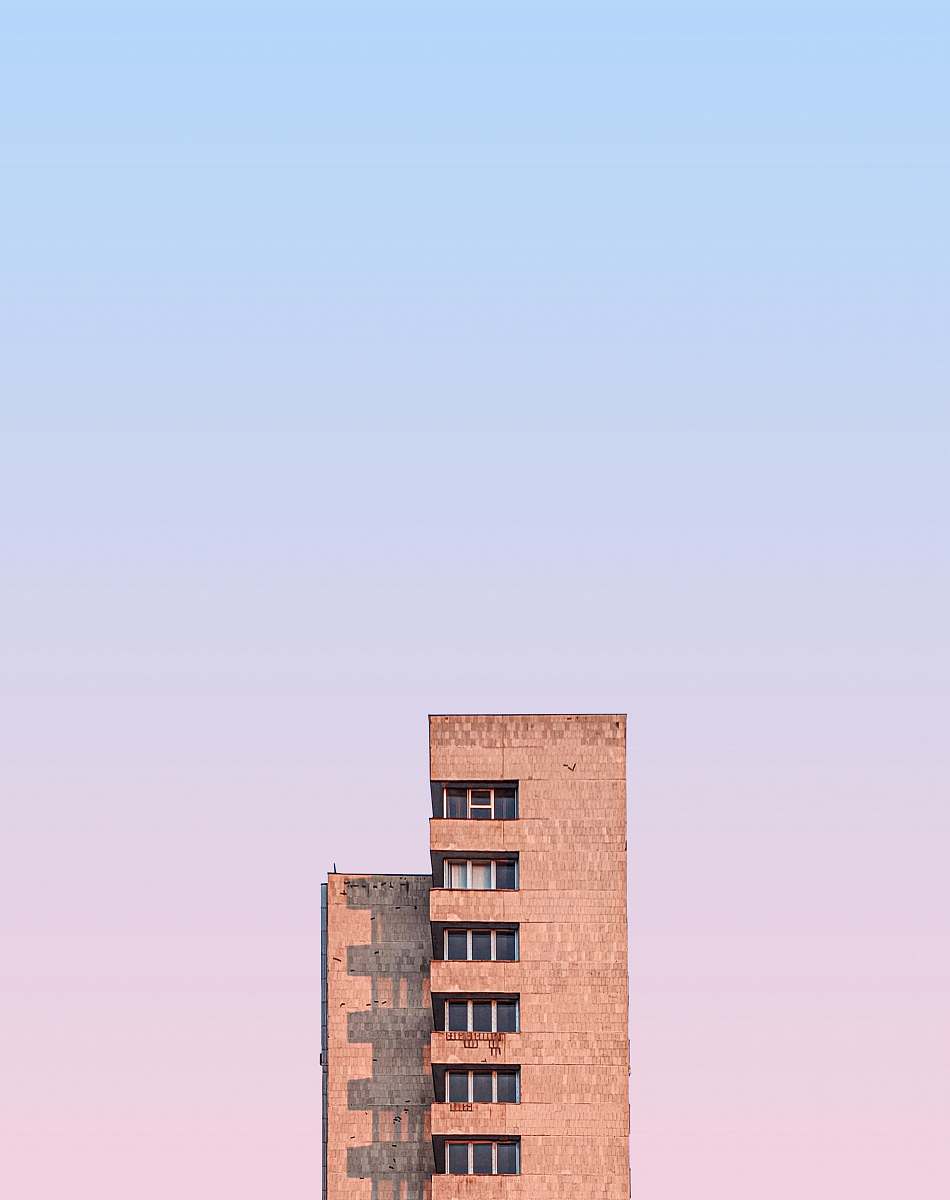 building beige concrete high-rise building urban