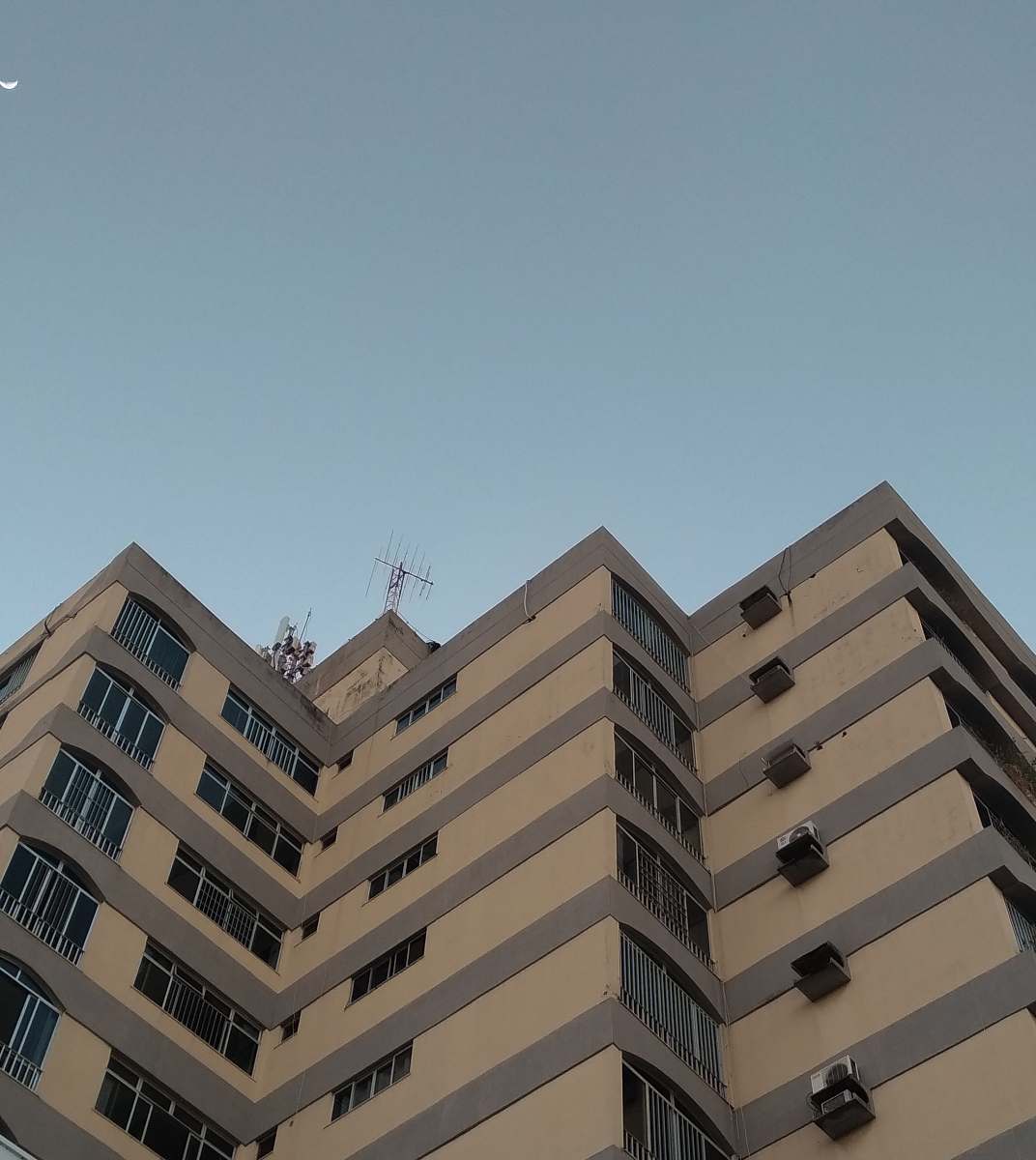 building beige high-rise building high rise