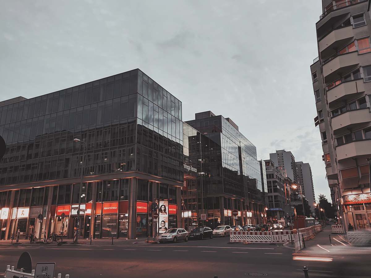 building black high-rise building during daytime road
