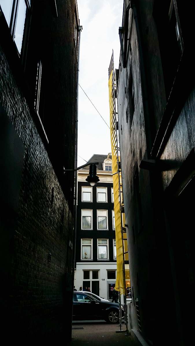building black vehicle parked beside building street