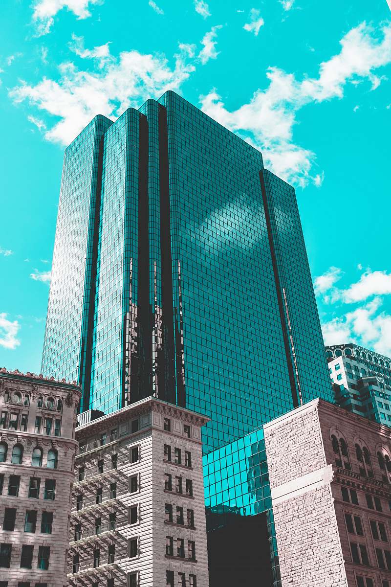 building blue curtain wall building under teal skies architecture