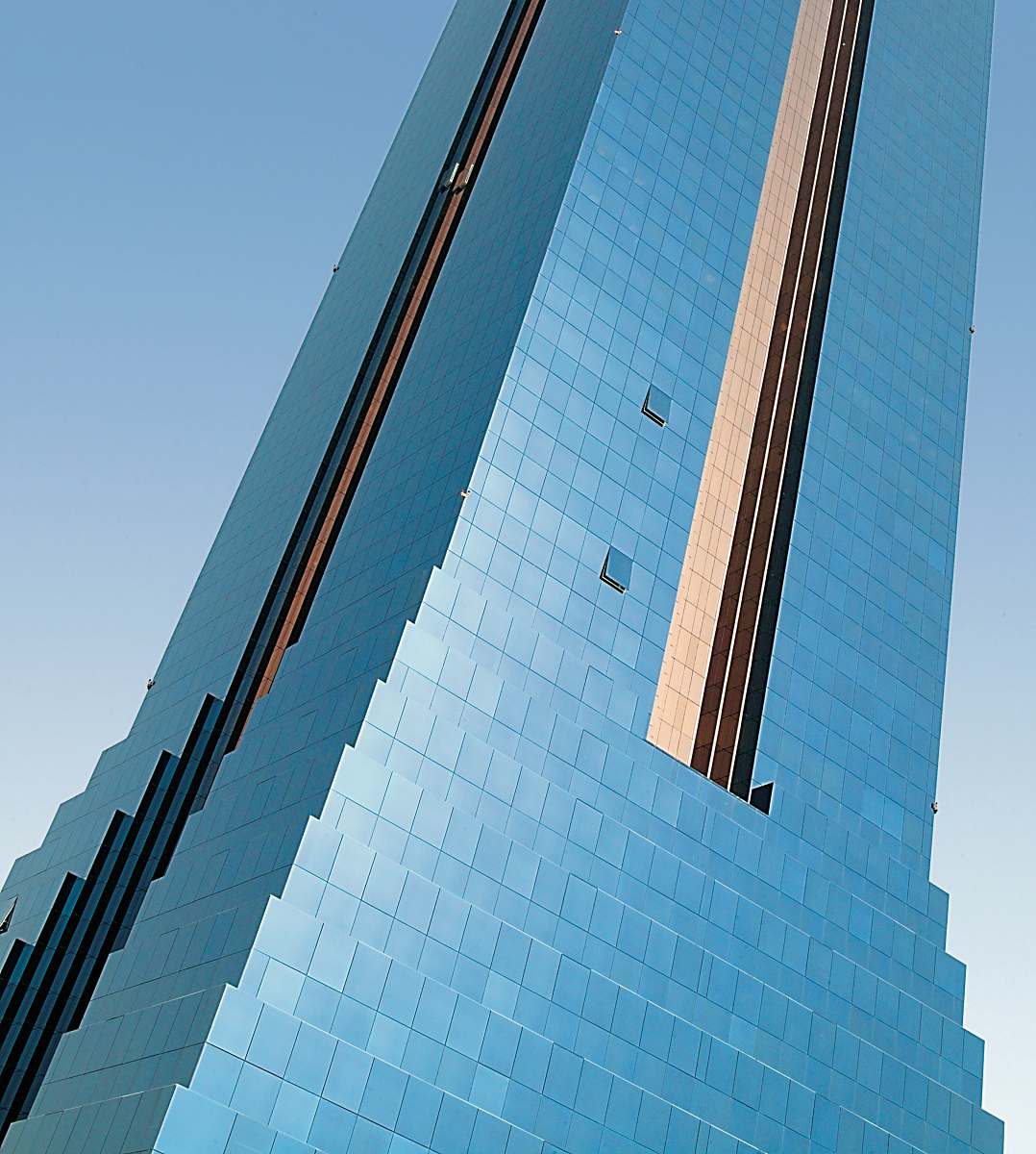 building blue glass walled high-rise tower building office building