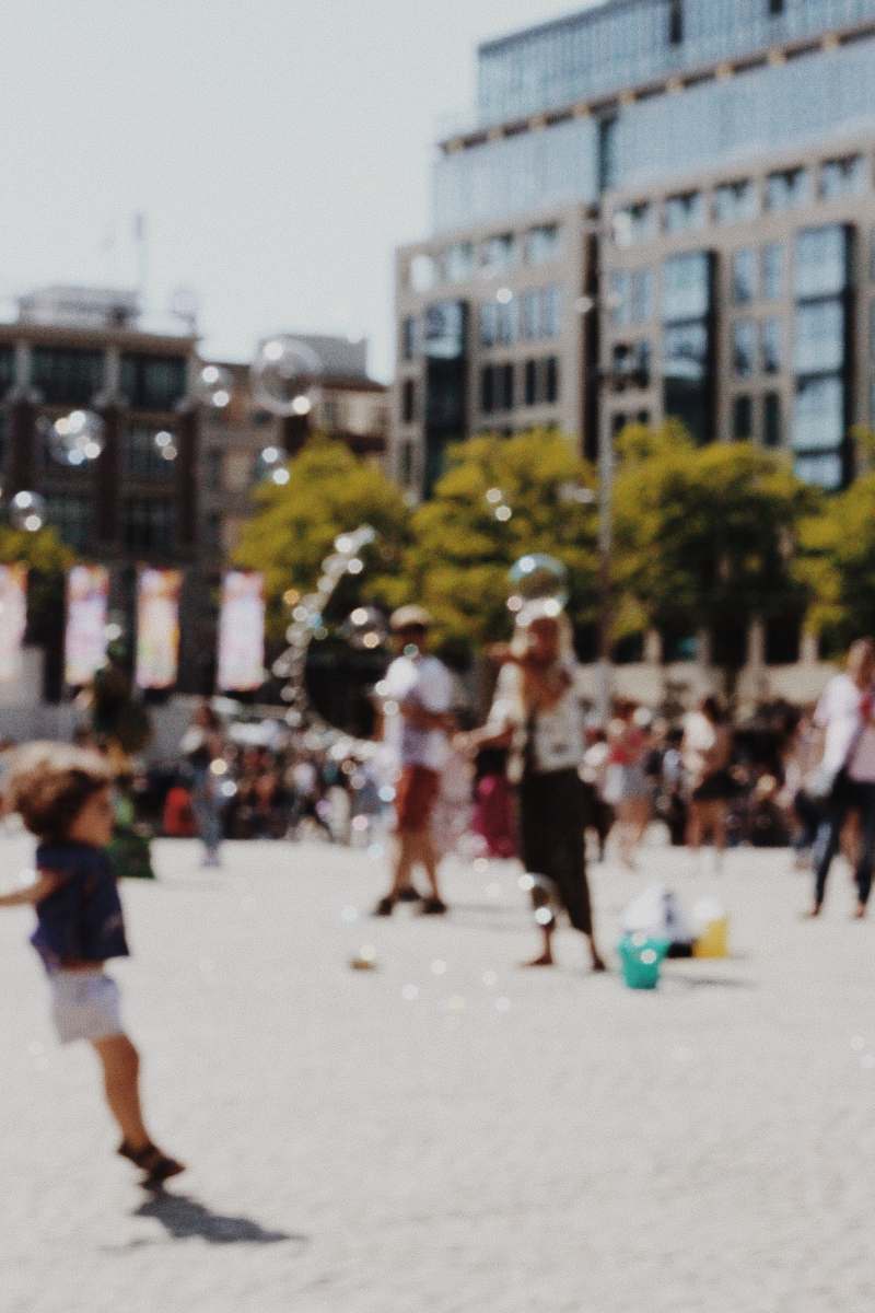 downtown blurry photography of people in a plaza urban