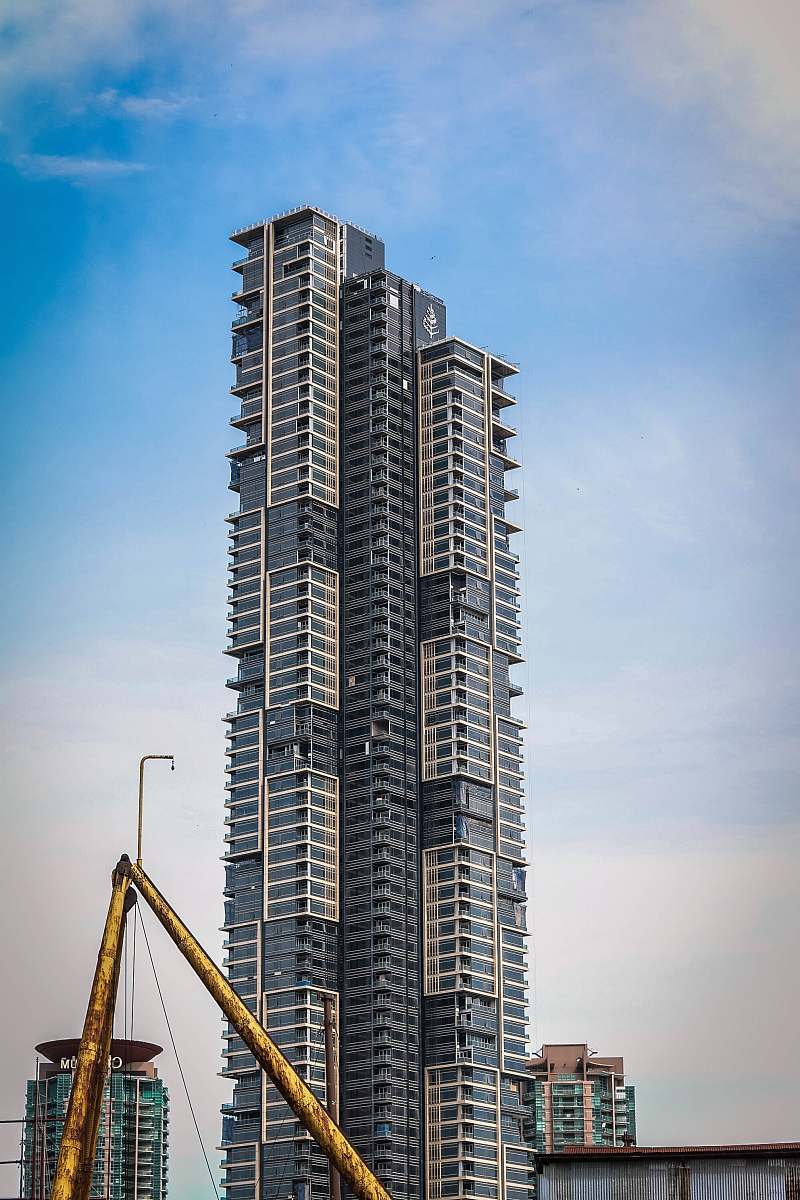 building brown and gray building during daytime high rise