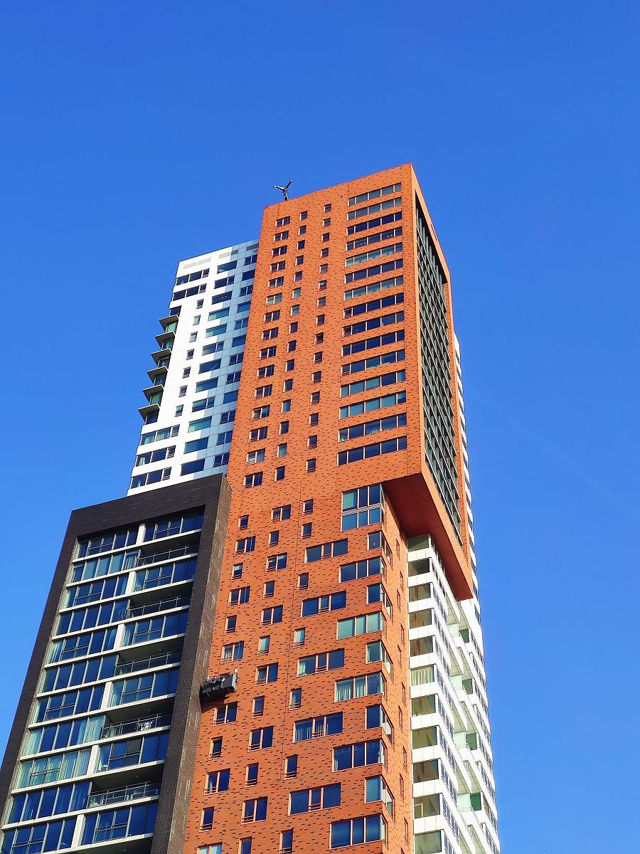 town brown concrete building photograph high rise