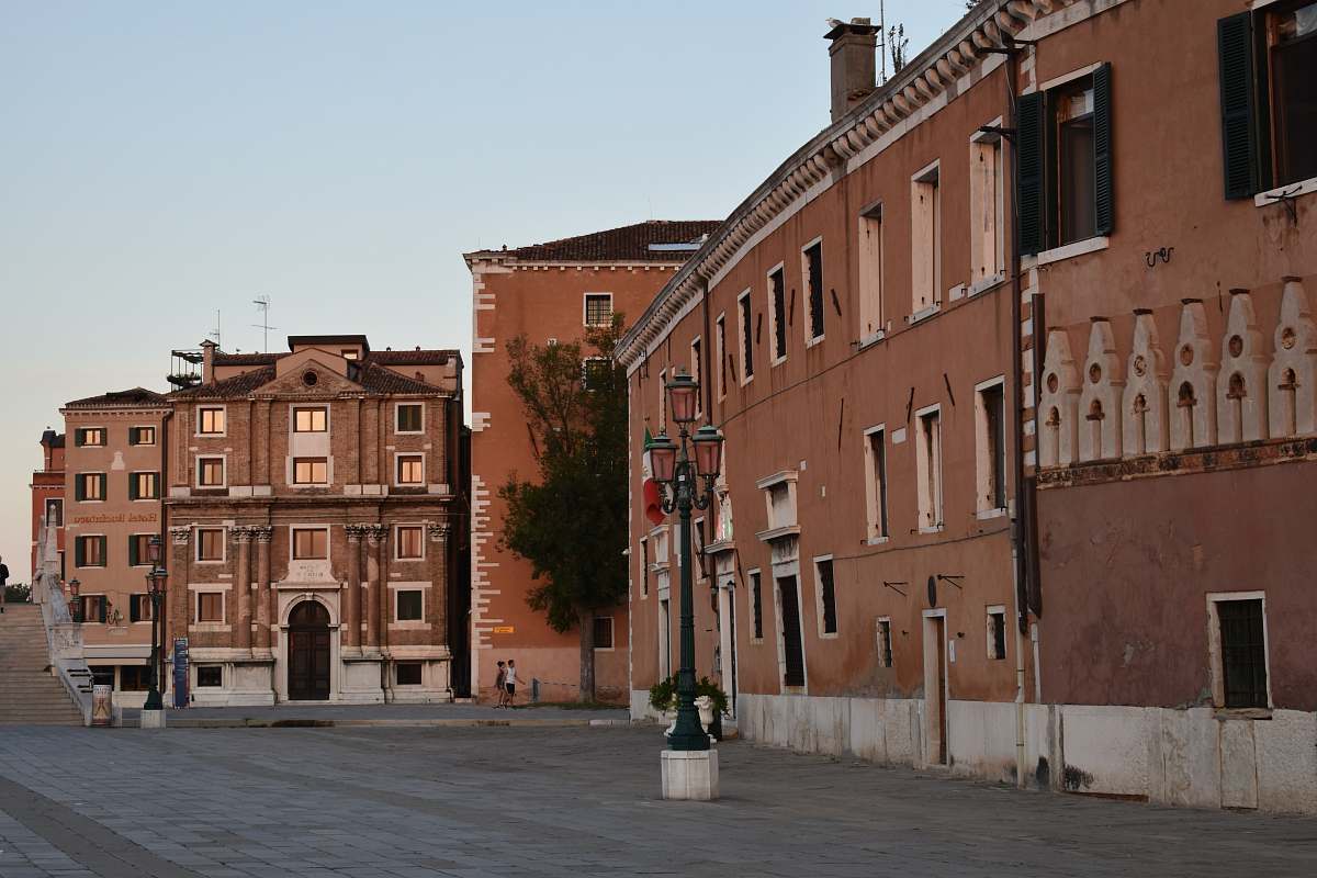 building brown concrete buildings showing road during daytime downtown