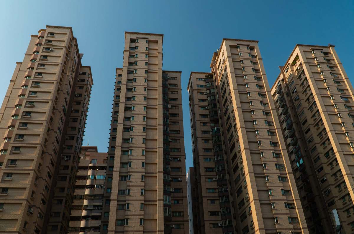 building brown concrete high-rise buildings high rise