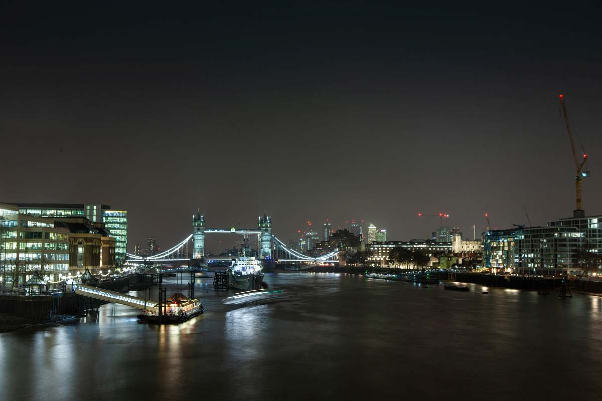 building city with bridge under nigh sky metropolis
