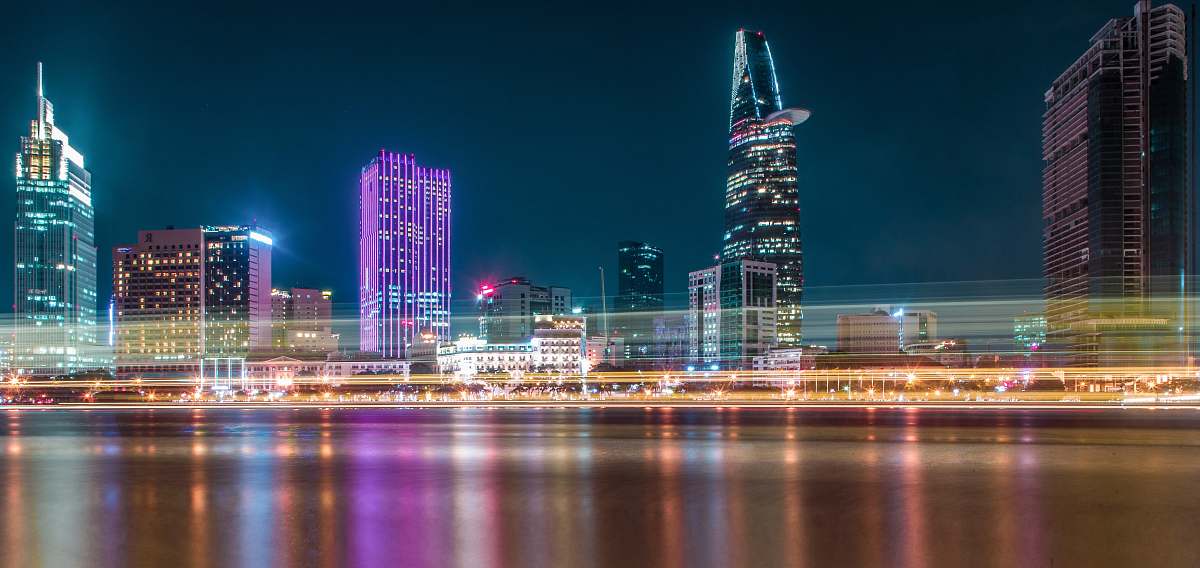 town cityscape during nighttime with lights turned-on building