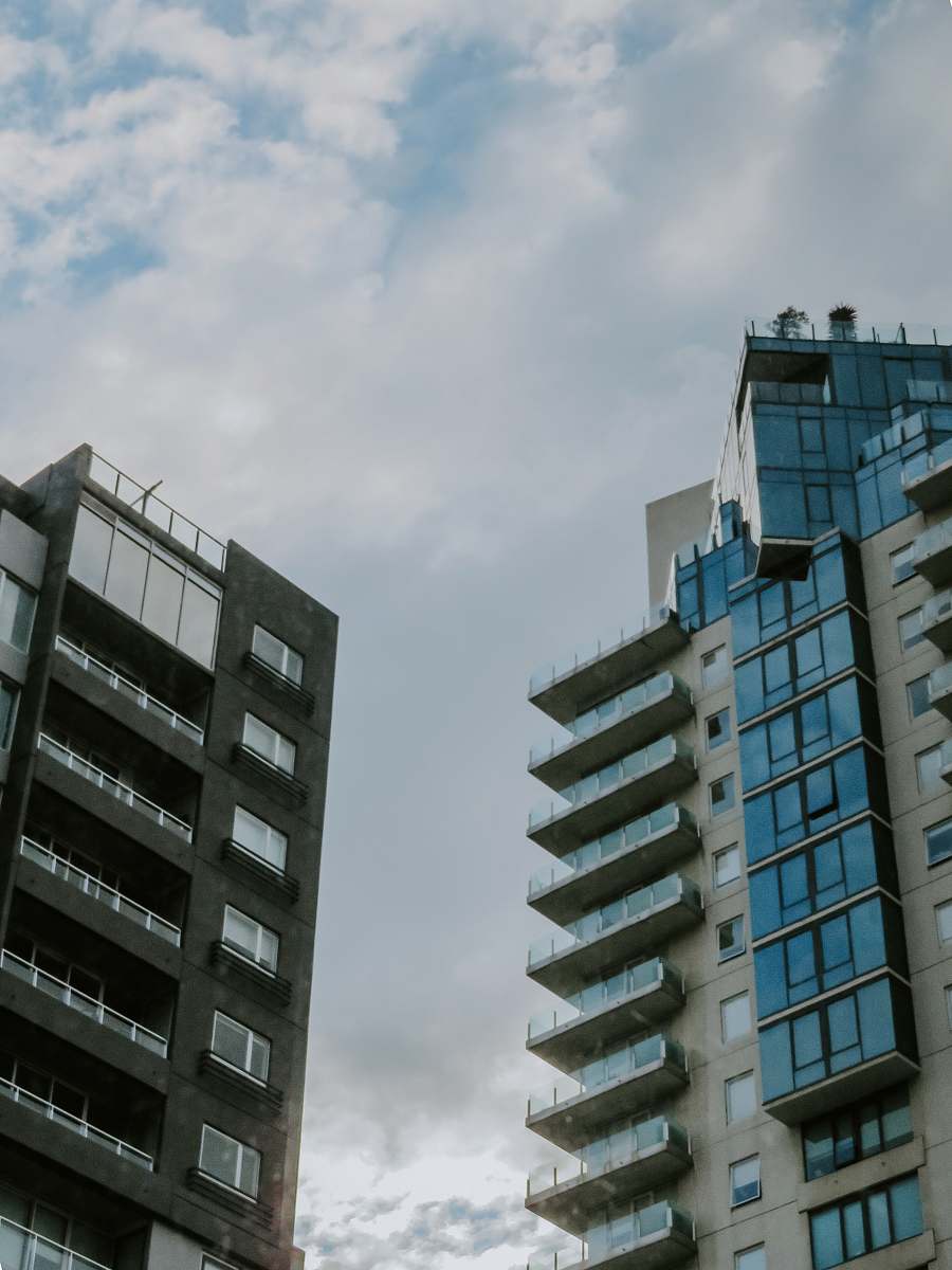 building concrete buildings under cloudy ksy high rise