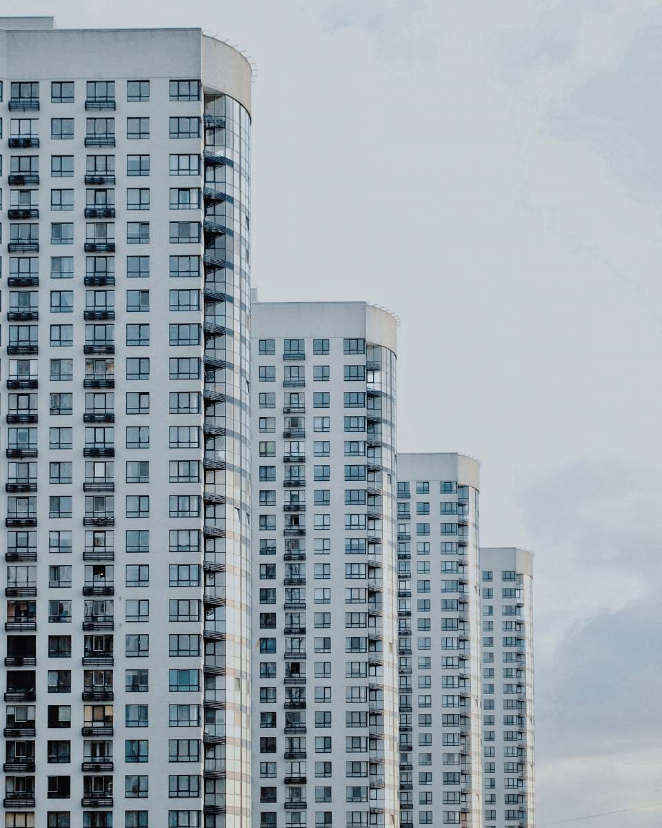 urban four white painted buildings high rise