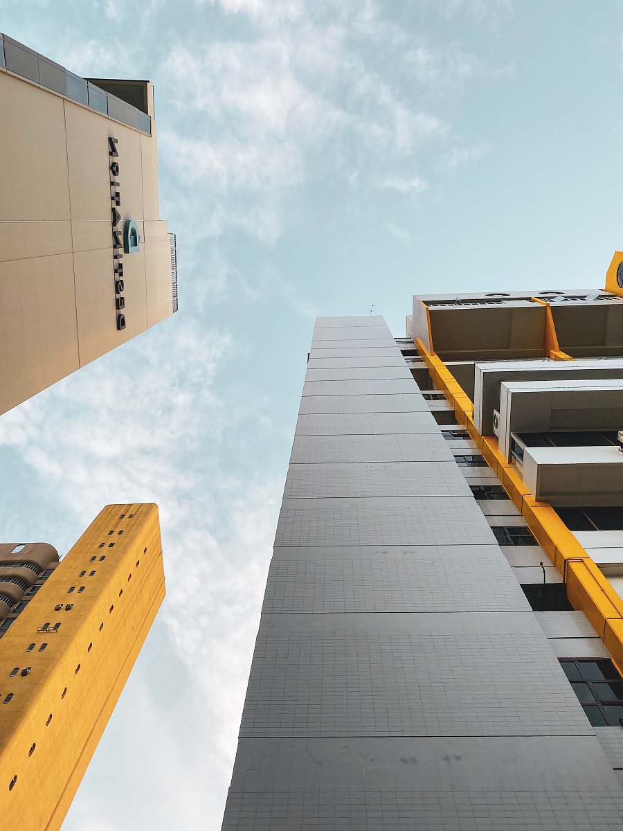 building gray and brown high-rise building high rise
