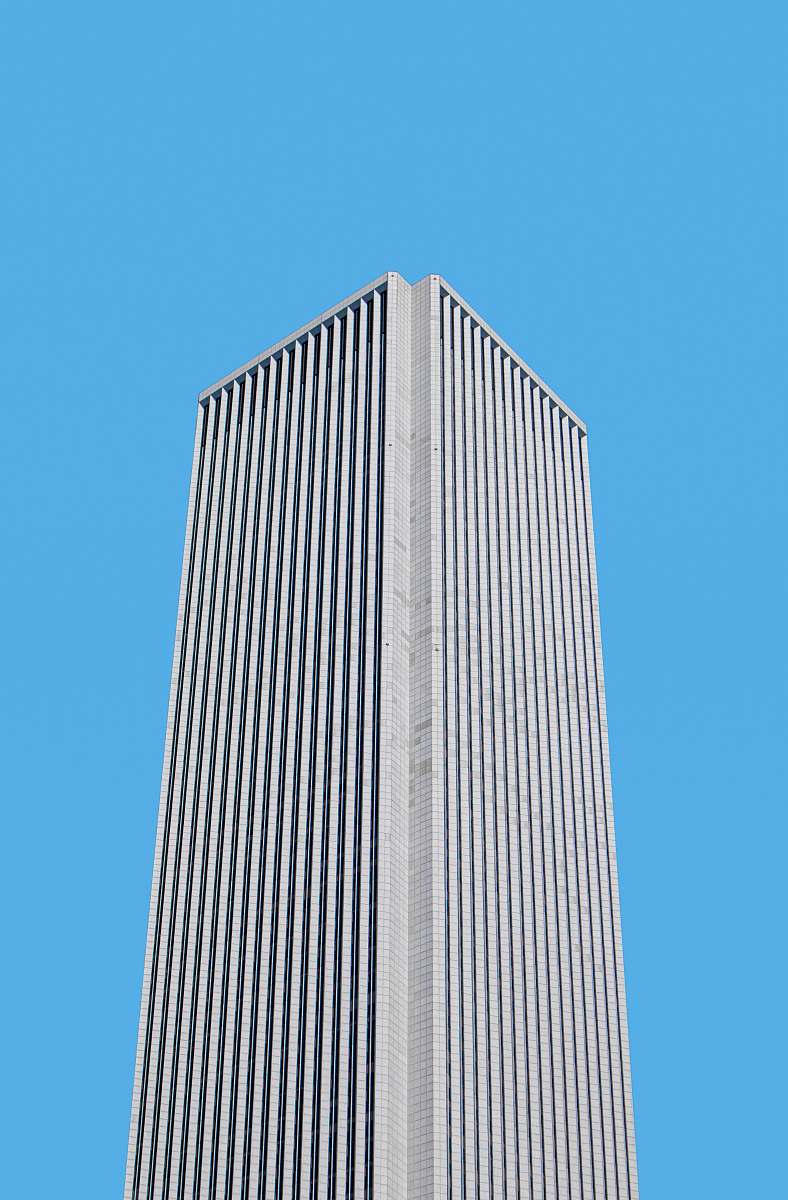 building gray concrete building during daytime high rise