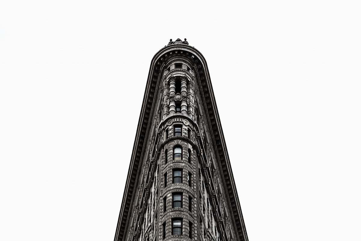 building gray concrete building in low angle photography black-and-white
