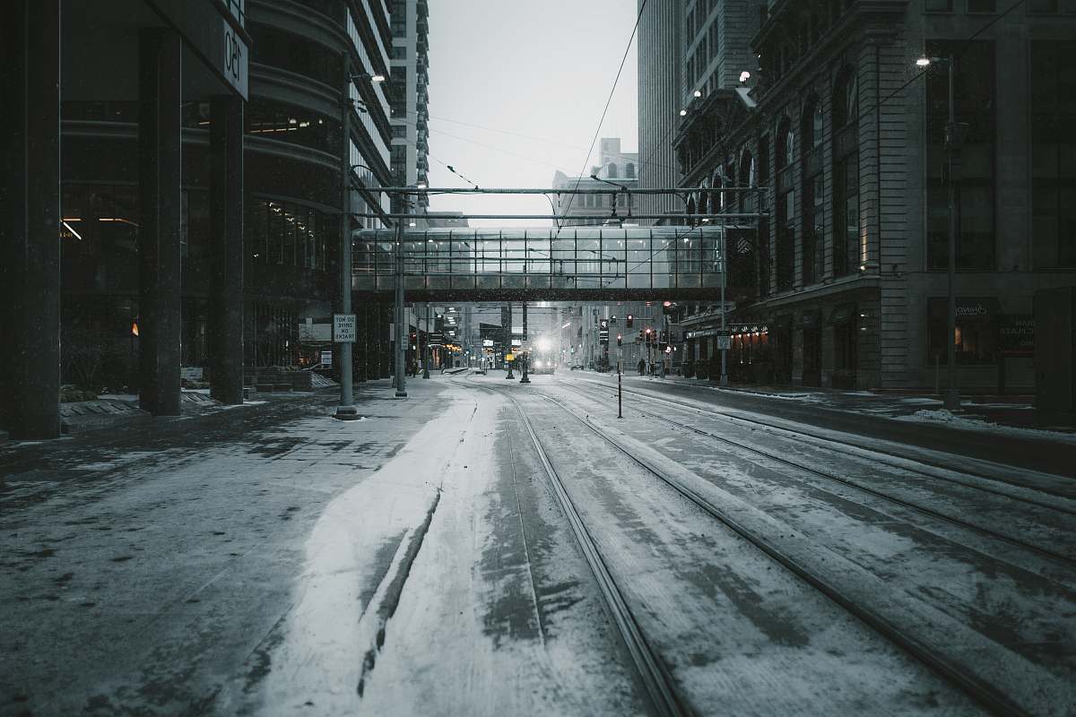 urban gray empty road across building bridge street