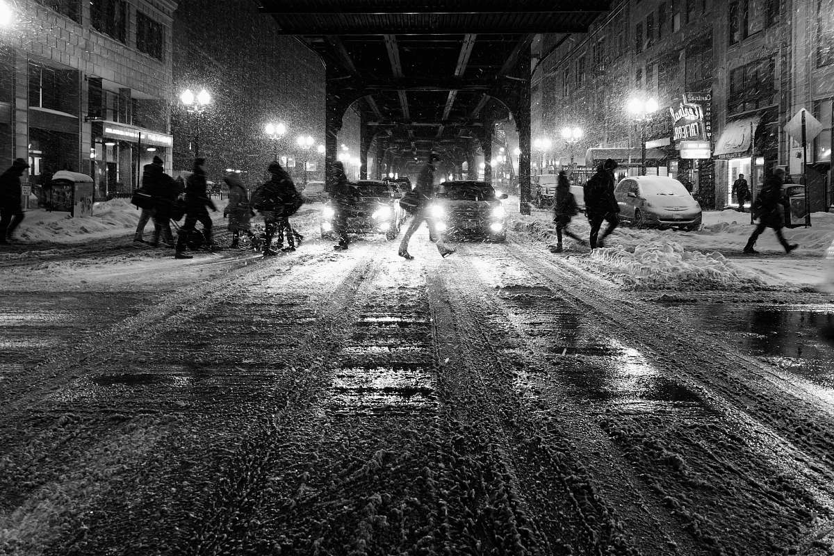 black-and-white grayscale photo of people walking on street snow