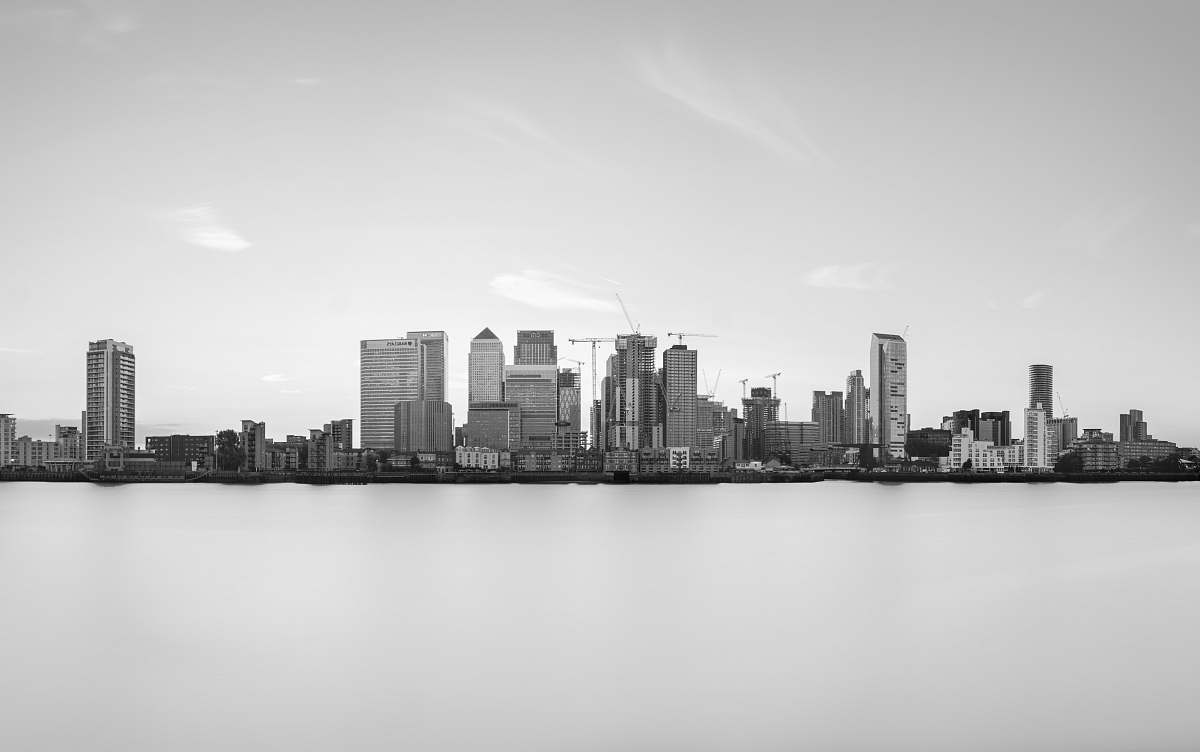 black-and-white grayscale photography of buildings near body of water town