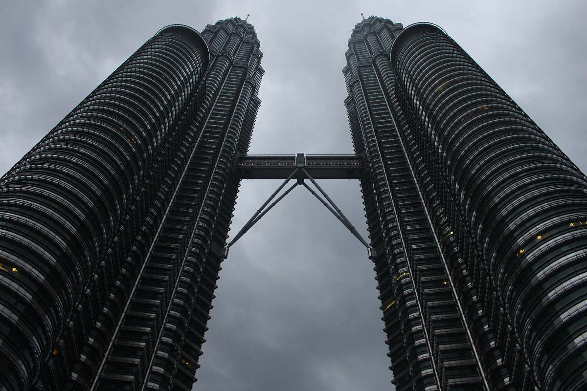 building grayscale photography of towers high rise