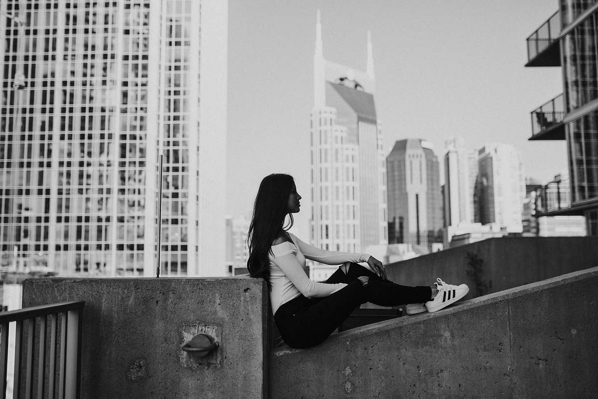 black-and-white grayscale photography of woman sitting person