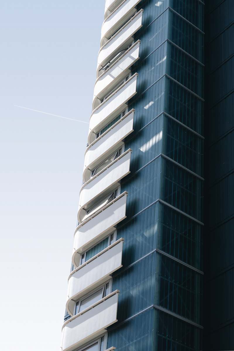 building grey and white curtain building during daytime urban