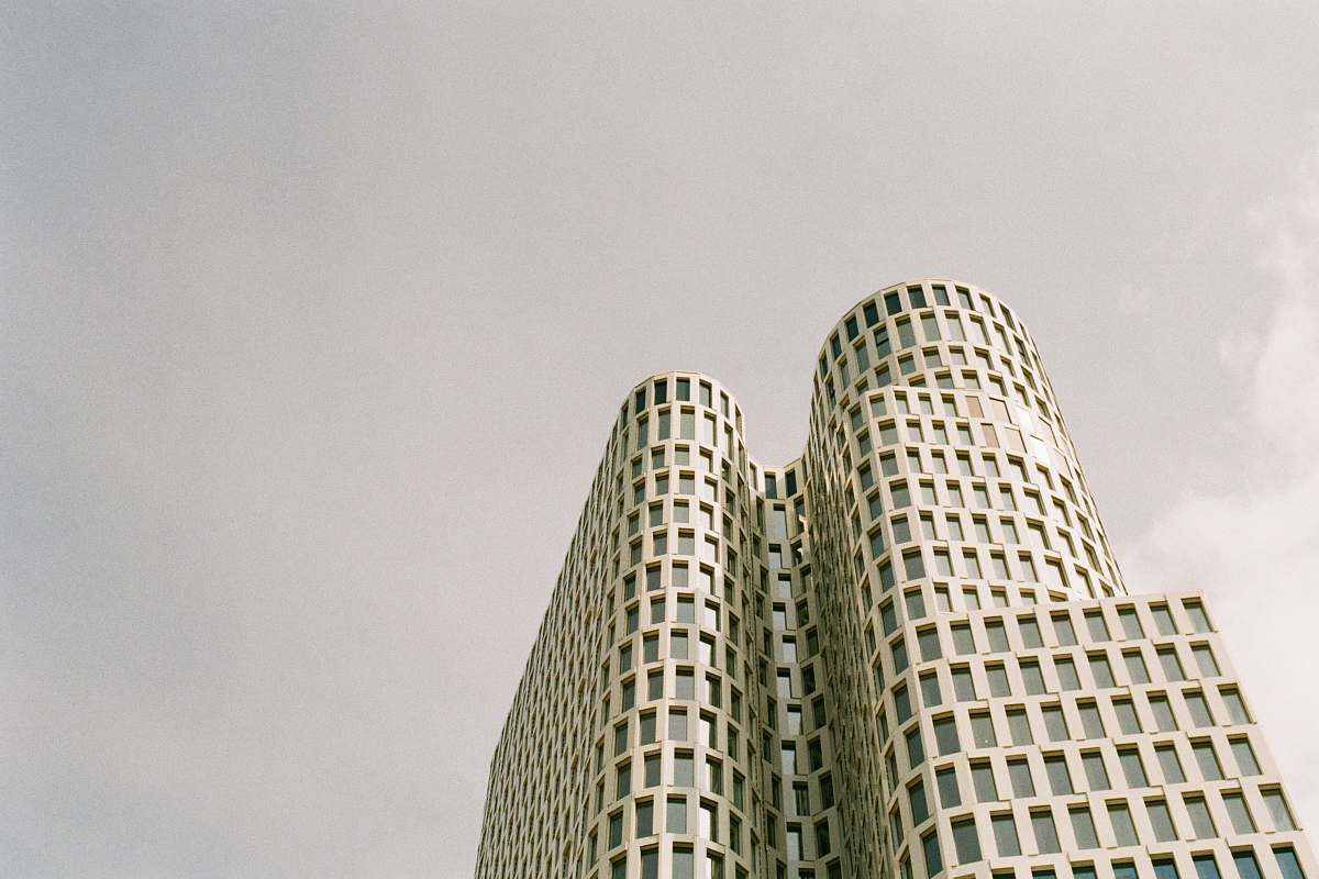 building grey concrete building during daytime high rise