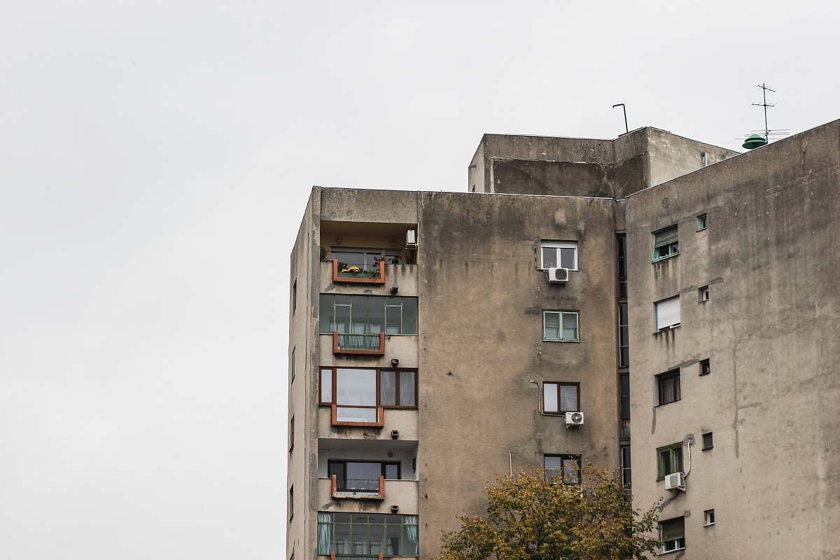 building grey concrete building under white sky urban