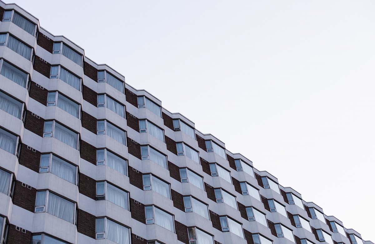 building grey highrise building high rise