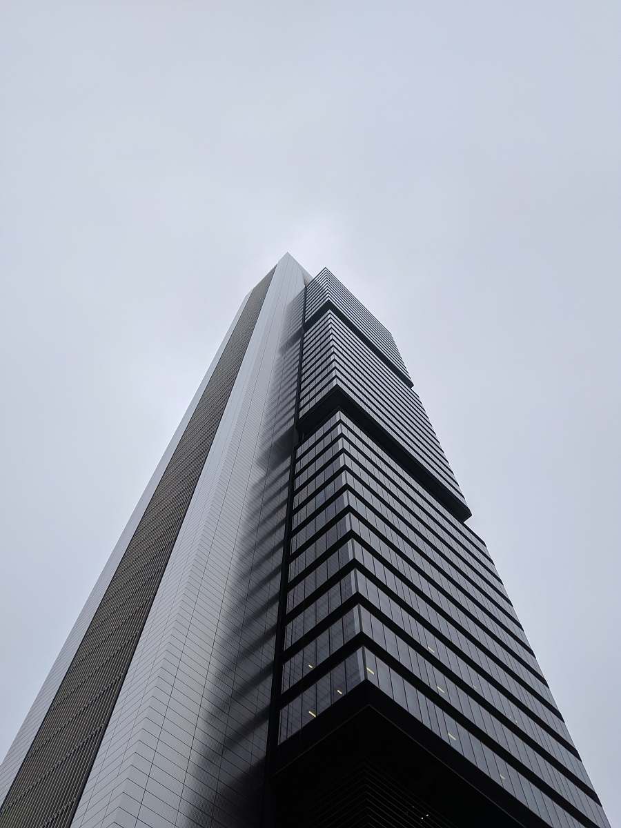 building greyscale photography of curtain building high rise