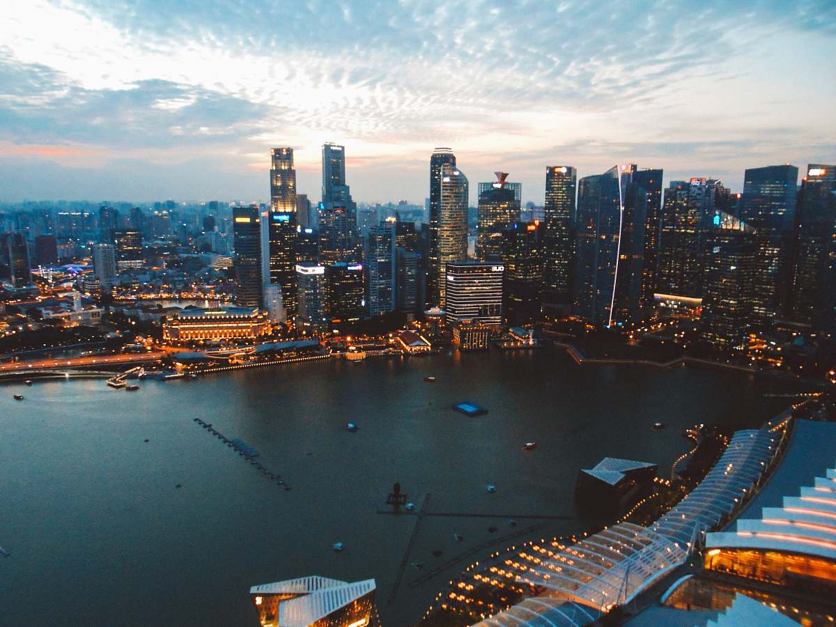 town high-angle photo of city buildings near body of water landscape