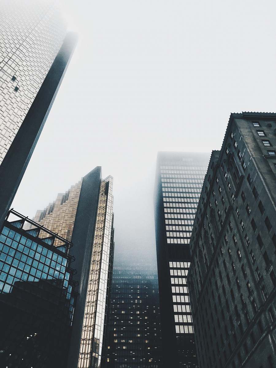 building high-rise buildings covered with fog architecture