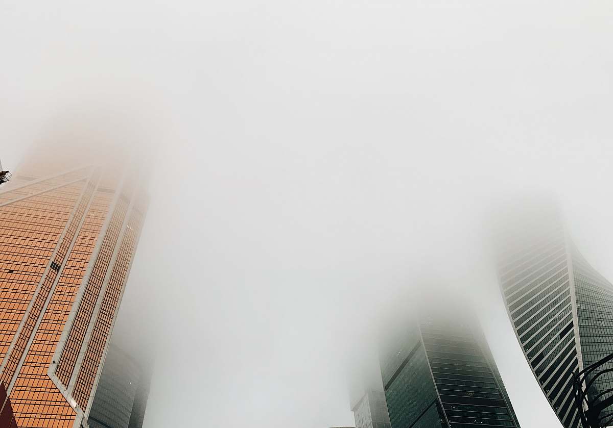 urban high-rise buildings covered with fogs nature