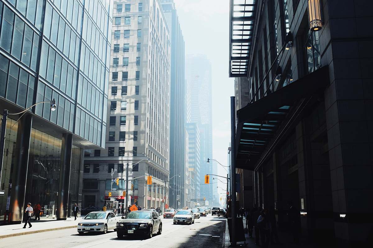 street high rise buildings during daytime road