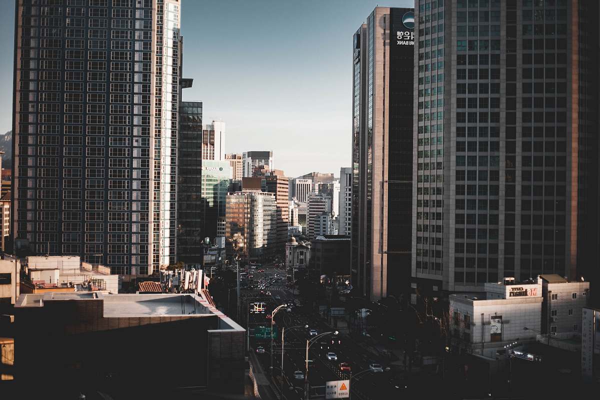 urban high rise buildings near road during daytime building