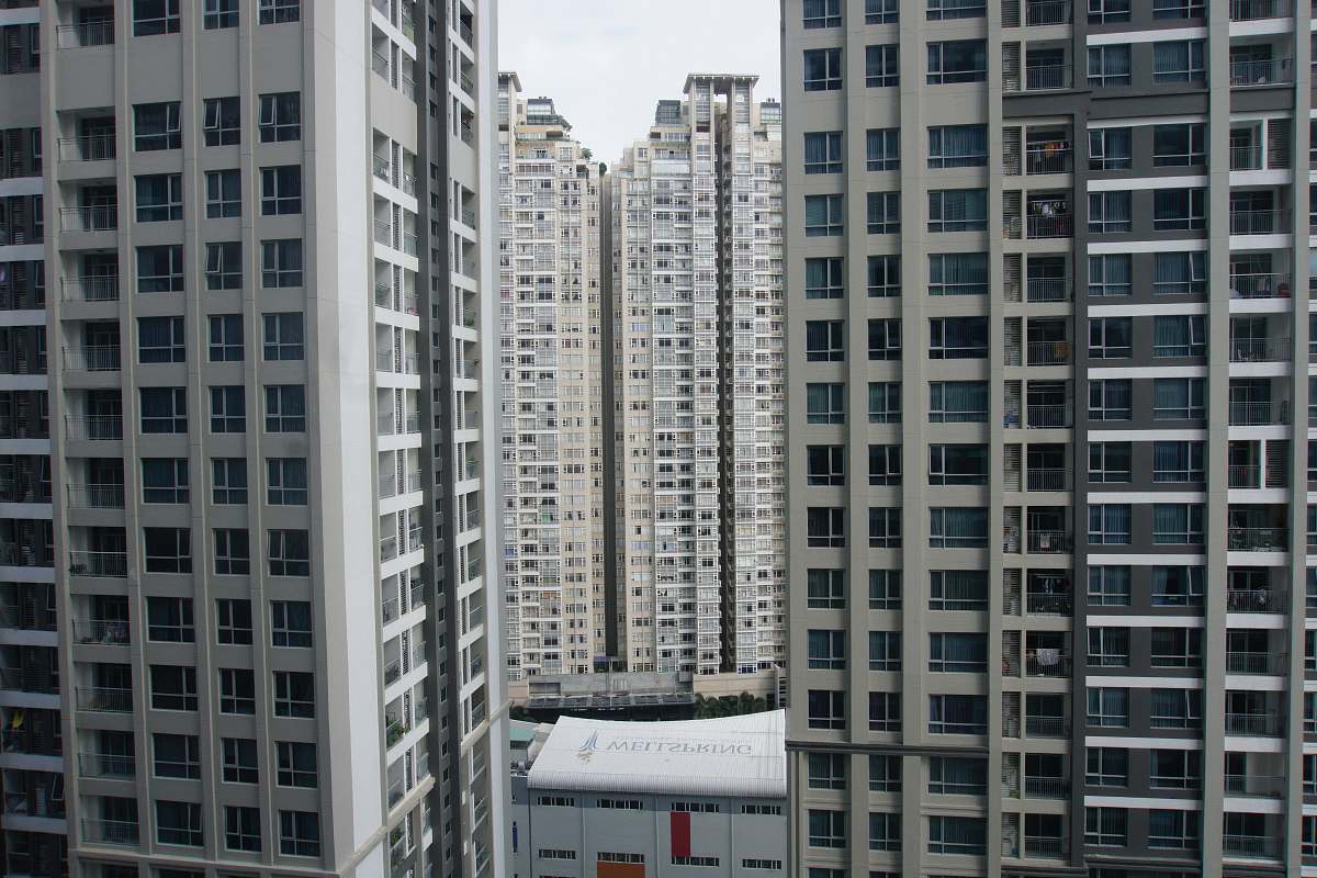 building high rise buildings under cloudy sky high rise