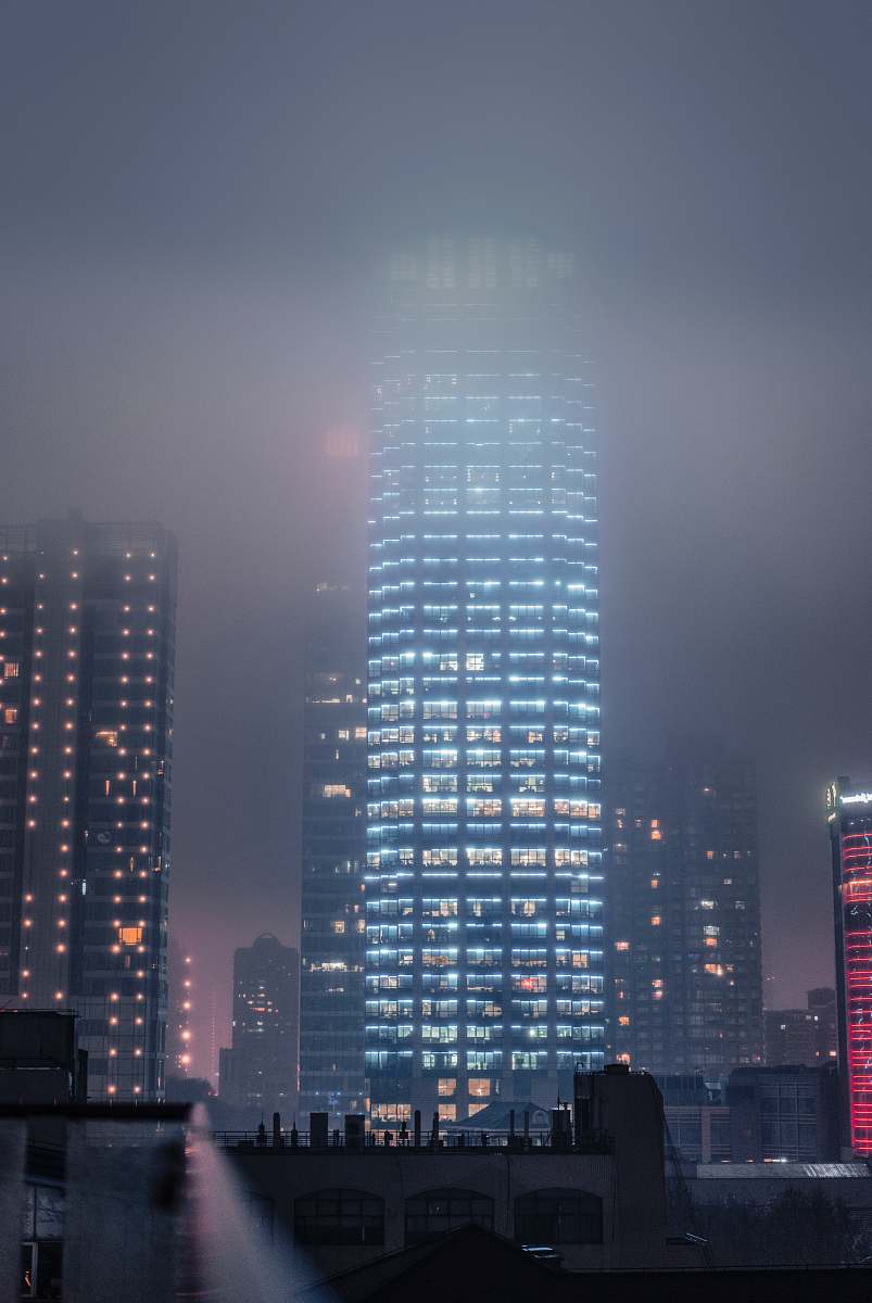 building lighted high rise buildings at night high rise