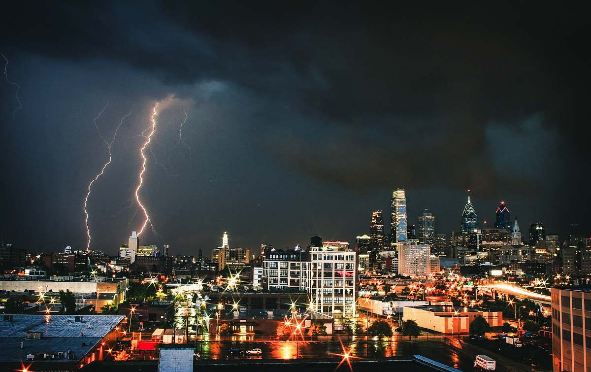 storm lighting strikes on city weather