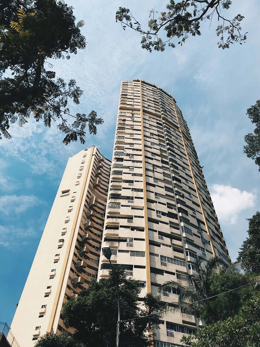 building low angle photo of concrete building high rise