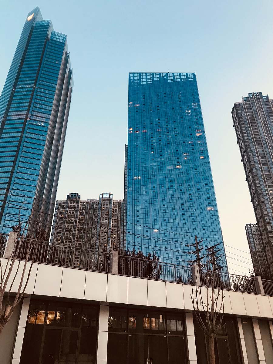 building low angle photo of curtain wall high rise building skyscraper