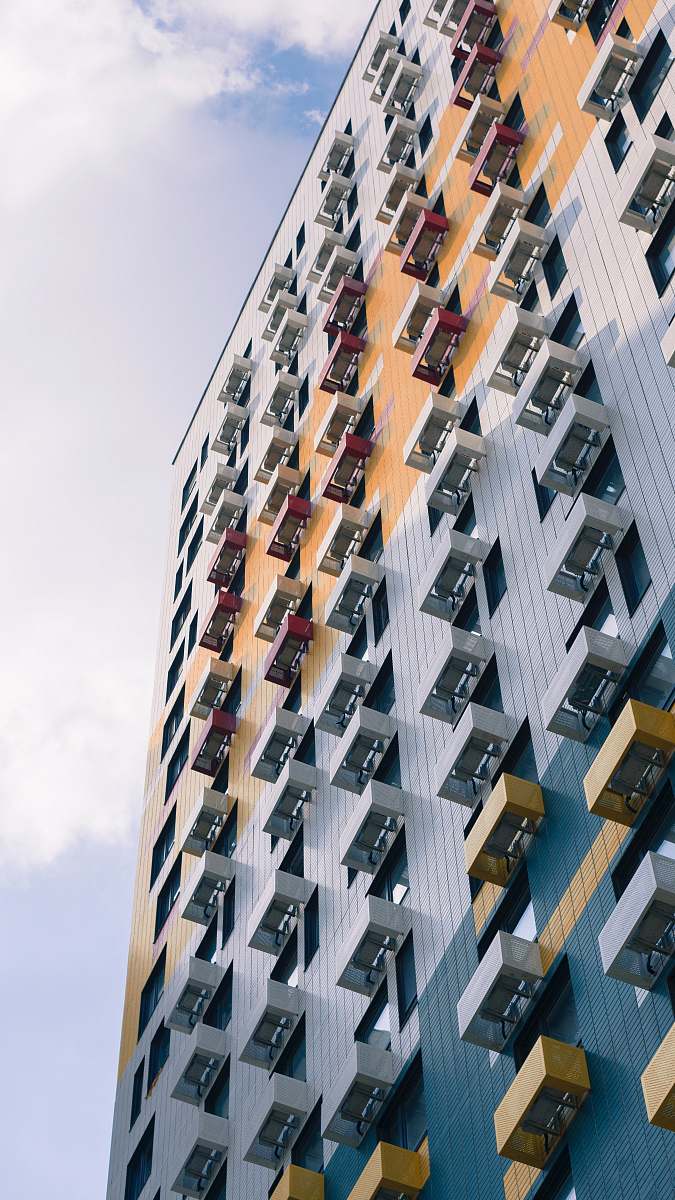 building low-angle photo of gray building high rise