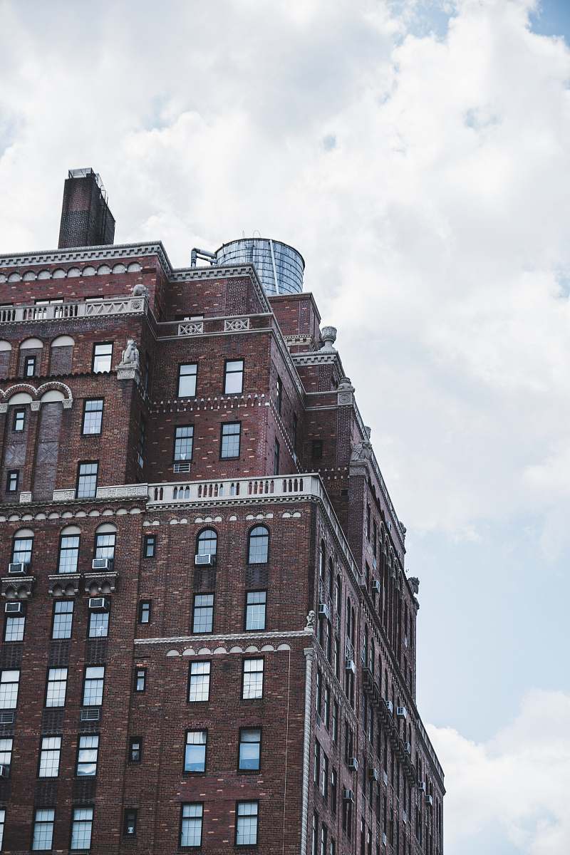 building low angle photography of brown structure high rise