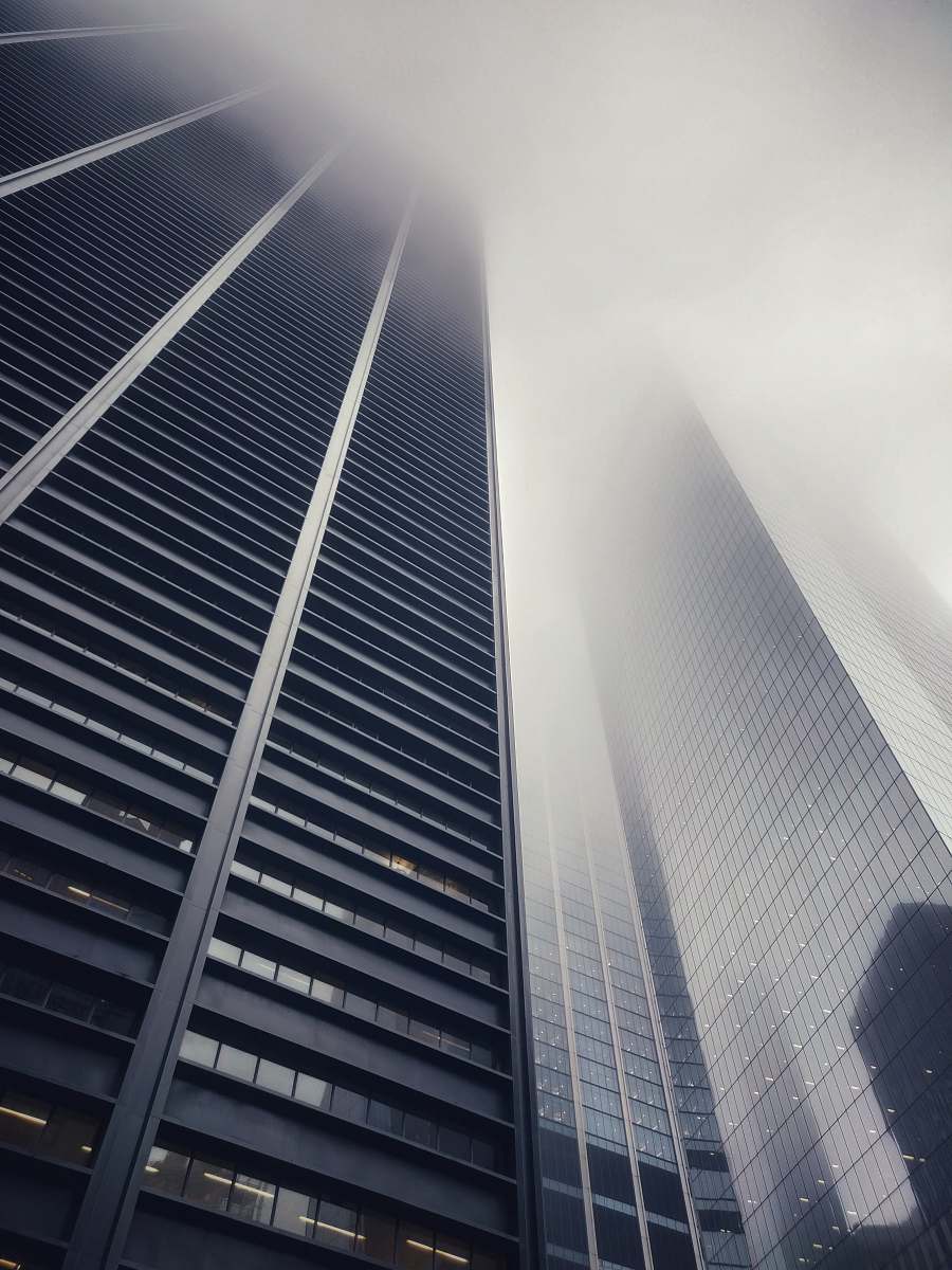 building low angle photography of concrete buildings high rise