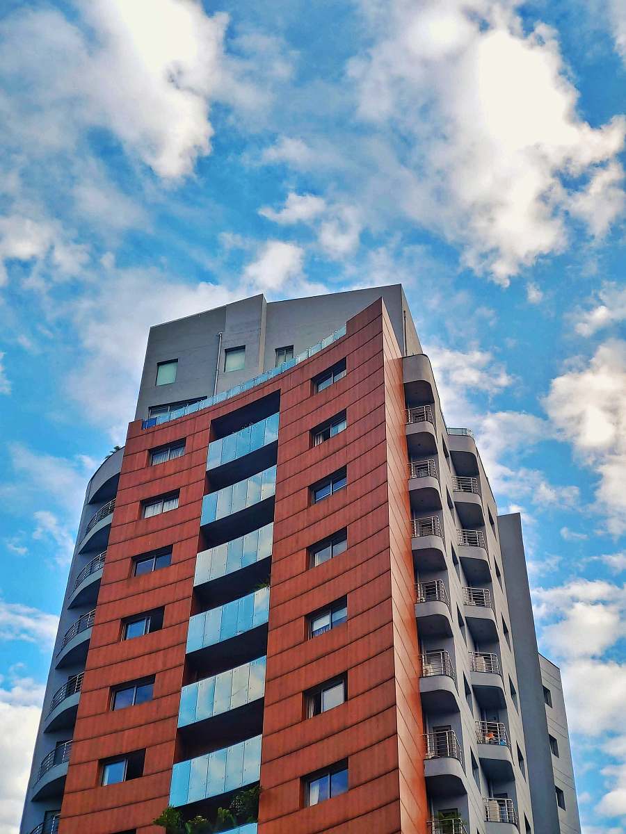 building low angle photography of orange and gray high rise building high rise