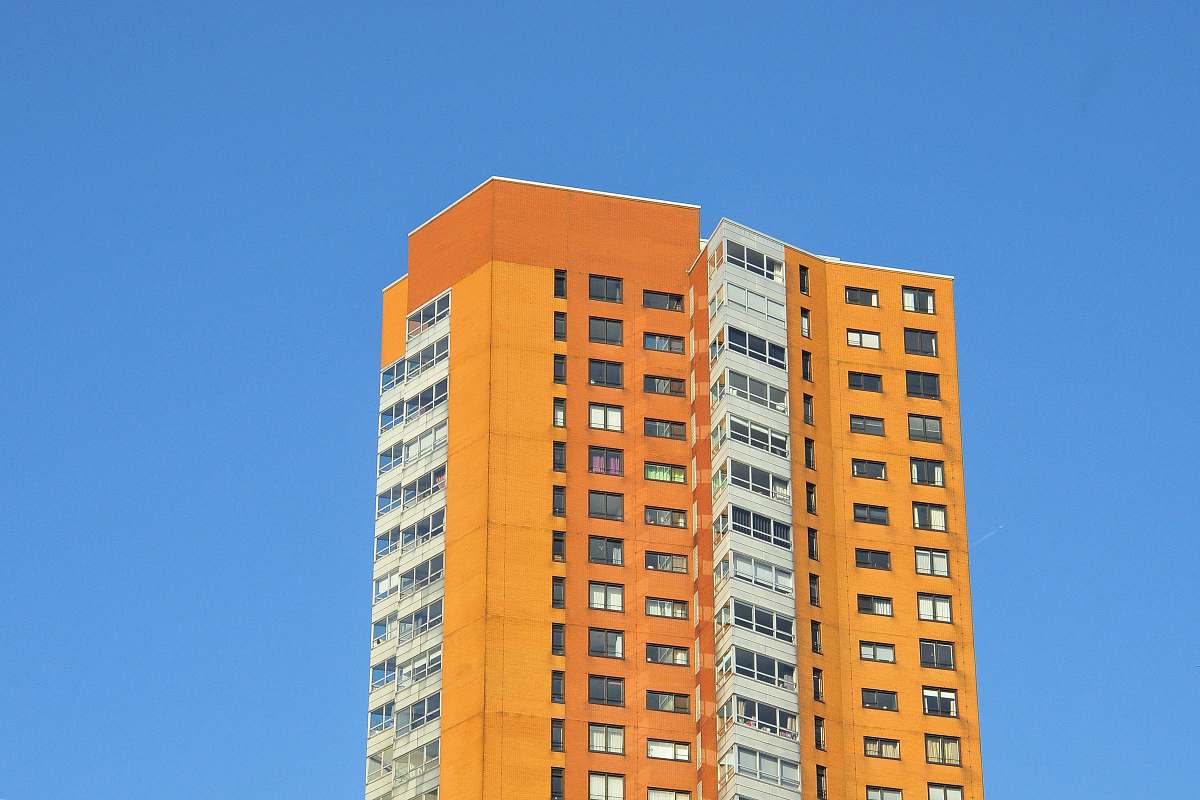 building low-angle photography of orange and white concrete building high rise