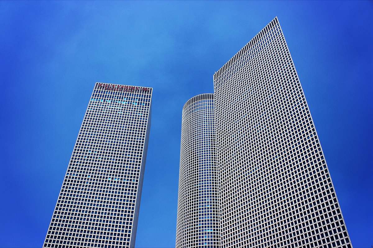 skyscraper low-angle photography of three high-rise buildings architecture