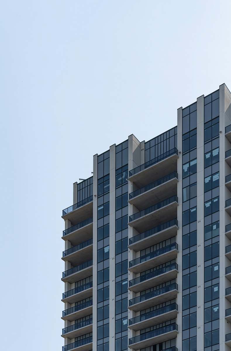 building low-angle photography of white high-rise building urban