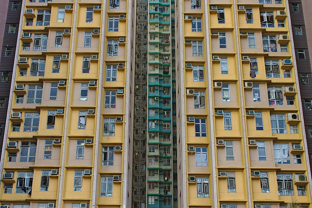building low-angle photography of yellow concrete building high rise