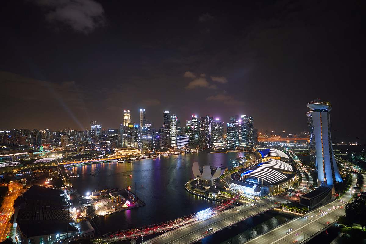 metropolis Marina Bay Sands and Helix Bridge, Singapore at night outdoors