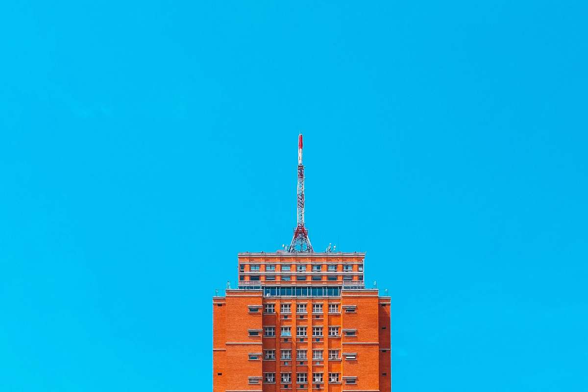 building orange concrete building urban